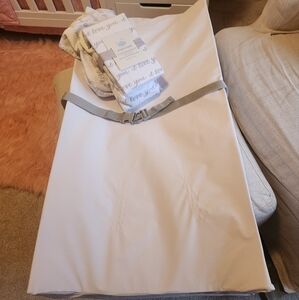 Munchkin waterproof baby changing station with two changing pad covers